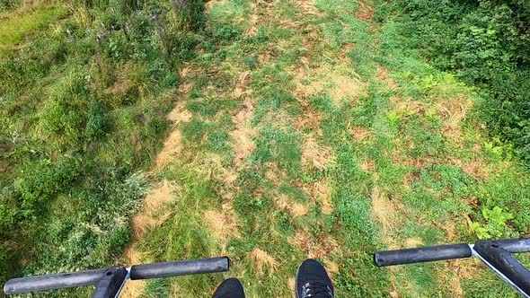 Girl Rides or Climbs on Lift or Cable Car Up Mountain alt
