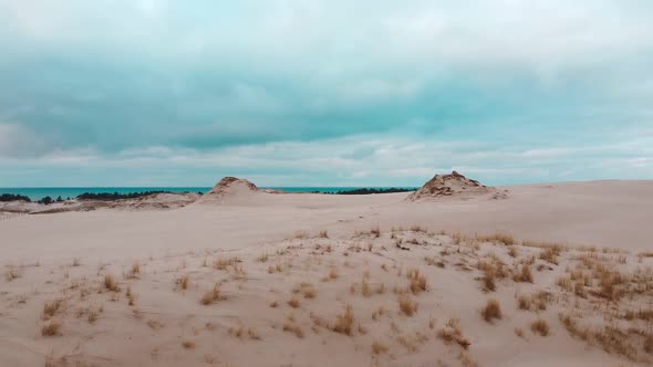 Sand dunes from drone. Amazing sea desert. Beautiful sky.