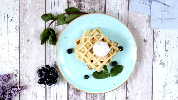 Presentation Fresh baked homemade classic Belgian waffles topped with icecream alt