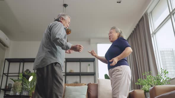 asian senior happiness couple home isolation concept,asian old retired adult dance together