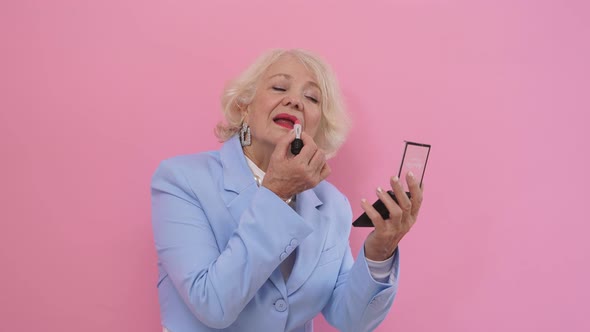 Portrait of a Beautiful Happy Mature Lady with Blonde Hair, Dressed in a Stylish Blue Suit, Wearing alt
