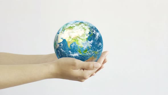 Woman Holding the Planet in Hands