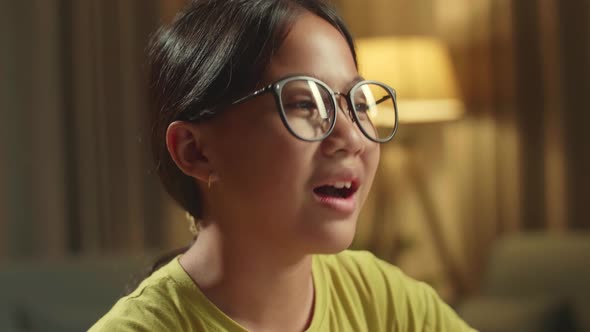 Close Up Asian Girl Learning Online From Home, Raising Hand Distance While Using Desktop Computer alt