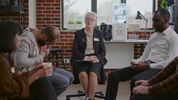 Woman Therapist and People with Addiction Meeting at Aa Group Therapy Session alt