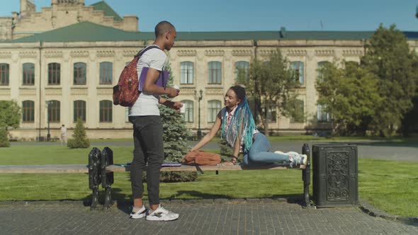 Tired Student Asleeping at Laptop on Bench in Park alt