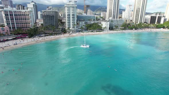 Aerial view of a luxury dinner cruise boat departs with couples looking to enjoy a sunset dinner. alt