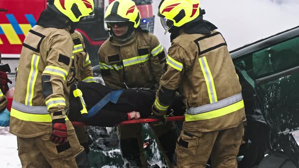 Firefighters Rescuing Person From Car Crash Accident alt