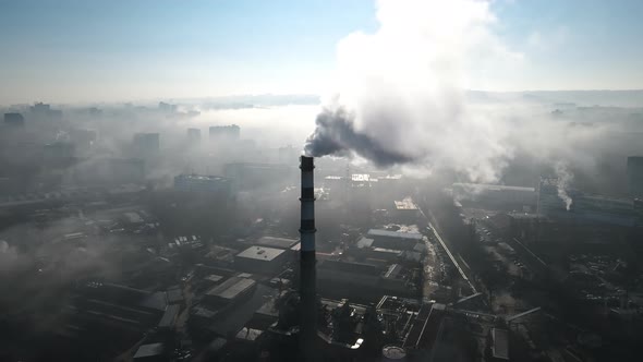 Aerial drone view of Chisinau. Thermal station with smoke coming out of the tube alt