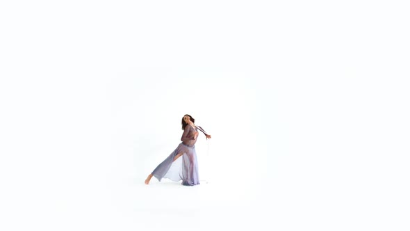 Young Woman Dancing With Gymnastic Ribbon On A White Background 3 alt