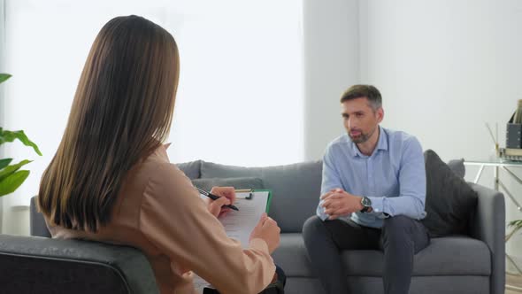 Smiling Adult Man Patient with Mental Health Problems Talking to Therapist alt