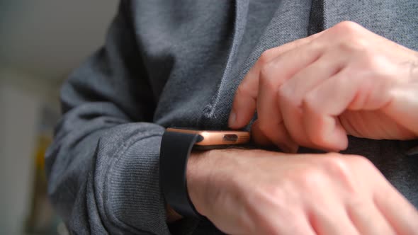 Person browsing messages on smart watches connected to internet alt