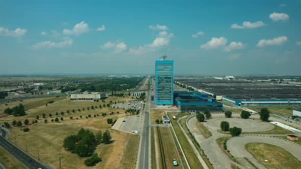Aerial View, Factory Area of the City, Highways and Streets, Cars Are Parked Near the Building. High