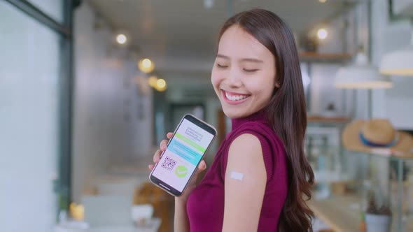 Asian female cheerful smiling teenager hand gesture point show vaccine brand alt