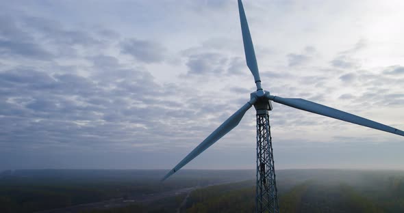 Wind Turbine with a Static Propeller in a Rural Wooded Area alt