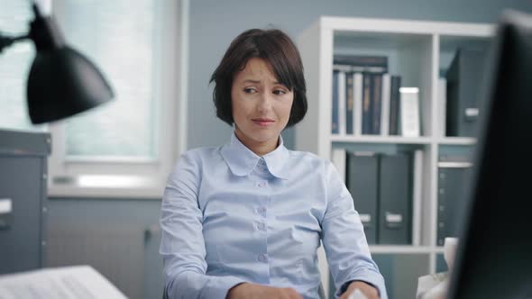Woman Having Burnout at Office