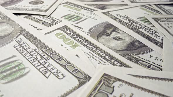 American One Hundred Dollar Paper Banknote Pile on Office Desk alt