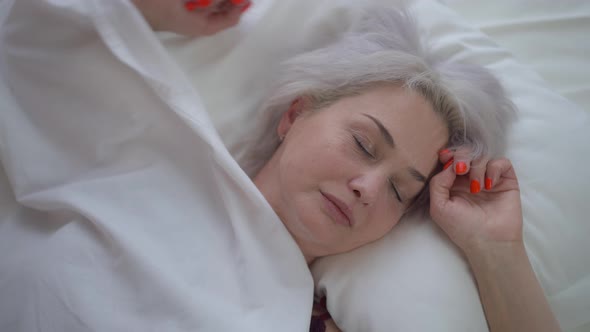 Closeup Sad Mature Woman Turning in Bed Having Nightmare Trying to Sleep alt