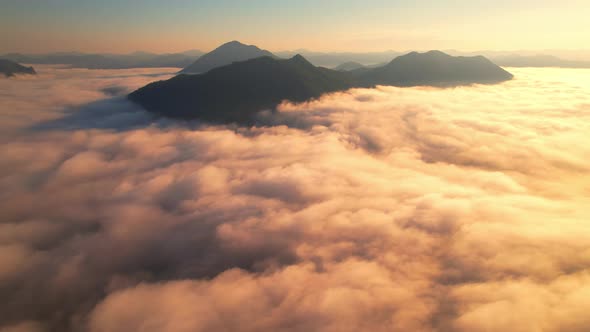 4K Aerial video Beautiful sunrise above dense clouds and fog in the morning alt