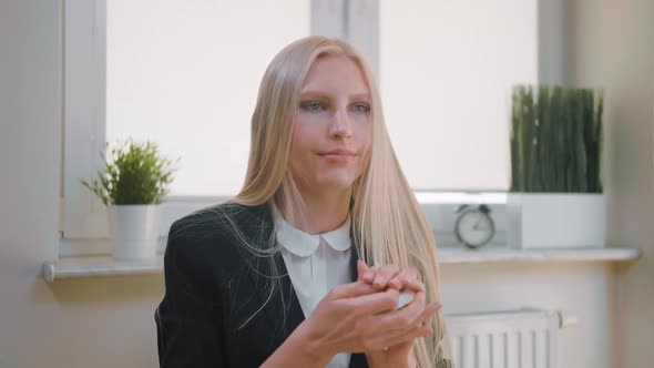 Beautiful Young Blond Female Suit Sitting at Desk Writing with Pen in Notepad, Turning Page and alt