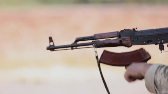 Armed Military Man Unloading Machine Gun While Lying with Gun Soldier Lying with Gun Military Army alt