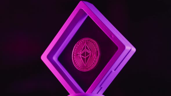 Etherium Coin in Transpanent Plastic Frame Rotates Around Its Axis