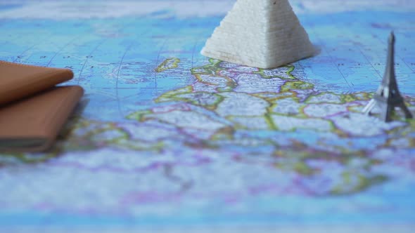 Foreign Passports and Souvenirs From Summer Vacation on Map, Travel by Car alt