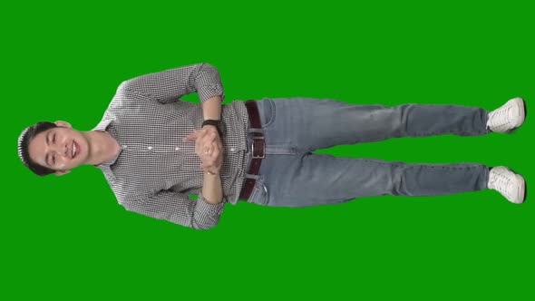 man talking to camera on green screen alt