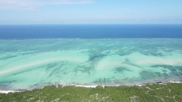 Aerial View of the Indian Ocean Near the Shore of the Island of Zanzibar Tanzania Slow Motion alt