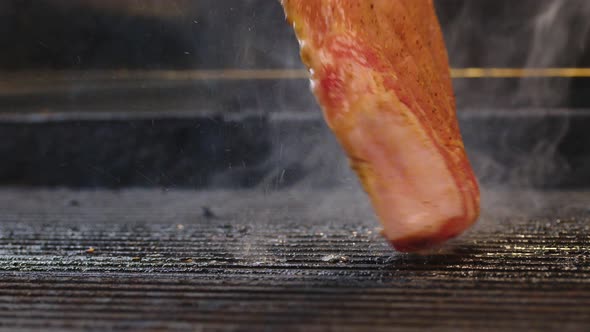 Sirloin Aged Prime Rare Roast Isolated Grilling Pork Filet with Stripes Slow Motion Shot alt