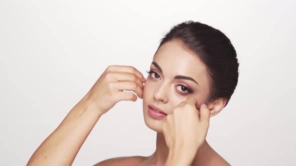 Studio portrait of young and beautiful brunette woman over alt
