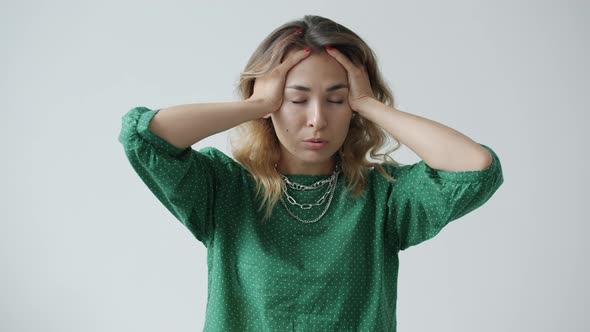 Slow Motion of Exhausted Young Woman Touching Head Suffering From Migraine alt