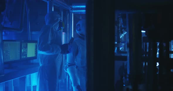 Scientists and Robot Conducting Maintenance Work alt