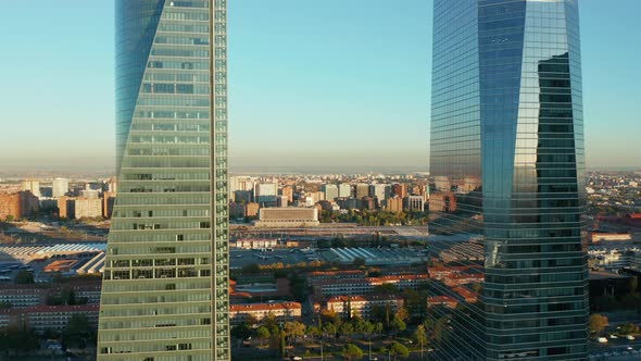 Forwards Fly Between Two Modern Office Towers alt