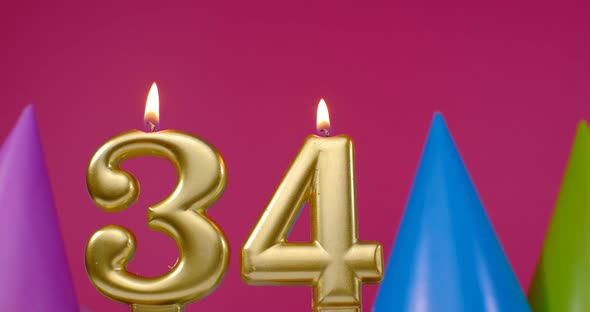 Burning Birthday Cake Candle Number 34