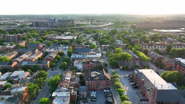 American city in USA. Aerial truck shot of neighborhood community during warm summer sunlight. alt