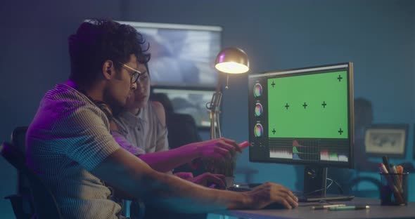 Video Editors at Work in Editing Room alt