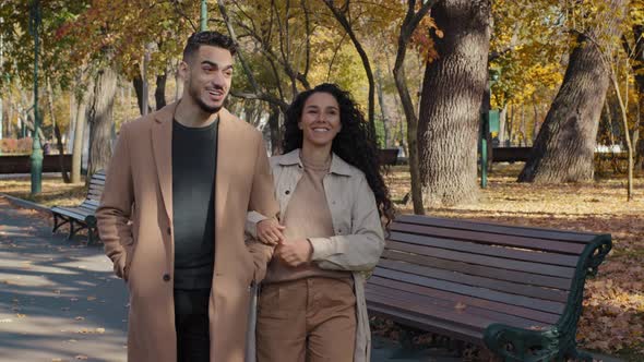 Young Family Walking in Autumn Park Enjoying Pleasant Conversations on Romantic Date Girl Holding alt