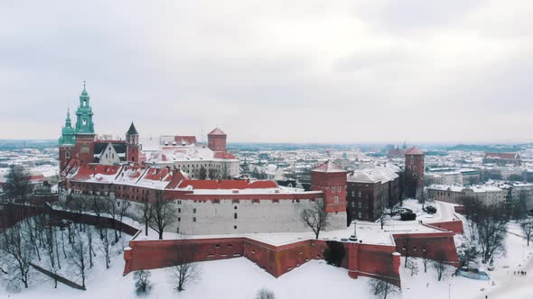 Aerial Footage of Wawel Royal Castle Located in Central Krakow Poland  SnowCovered alt