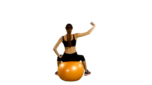 Fitness Girl Doing Fitness Exercise with Fitness-ball, Gym. White Background alt