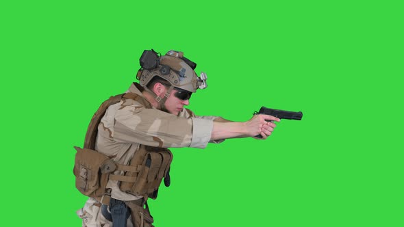 Modern Soldier, Counter Terrorist Squad Fighter Aiming and Shooting with Pistol on a Green Screen alt