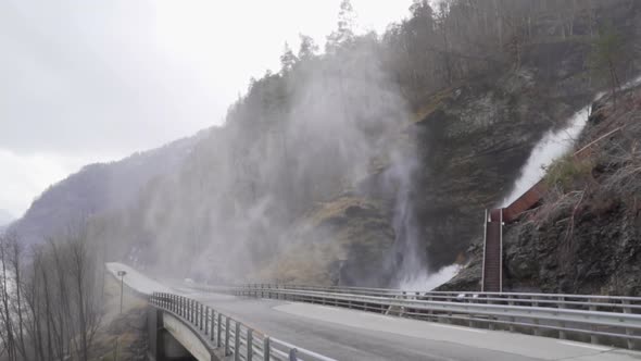 Water falling and flying in Svandalsfossen waterfall in Norway, view from the road_slomo alt