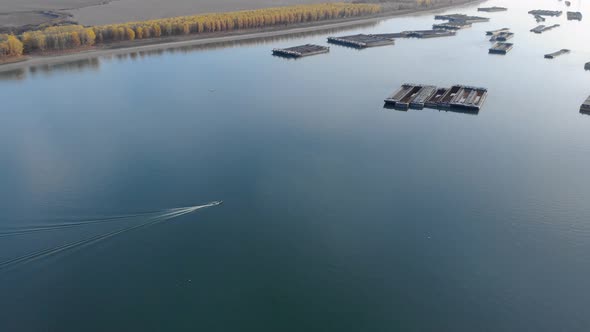 Aerial View Of The Ships Sailing On Danube River Near The Riverside