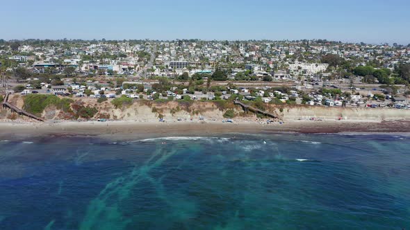 Drone shot flying towards Encinitas city and Cardiff-by-the-sea beach, America alt