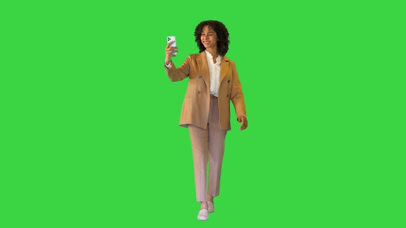 Cheerfull Black Lady Taking a Selfie on a Green Screen Chroma Key alt