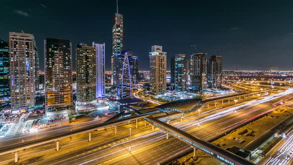 Buildings of Jumeirah Lakes Towers with Traffic on the Road Night Timelapse alt