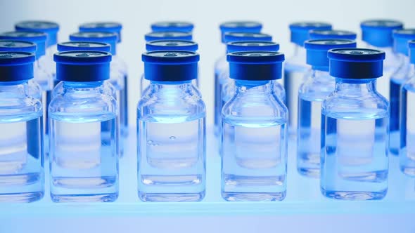 Group of Vaccine bottles. Medicine in ampoules. Glass vials for liquid samples in laboratory. alt