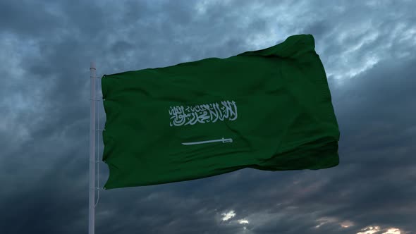 Realistic Flag of Saudi Arabia Waving in the Wind Against Deep Heavy Stormy Sky alt