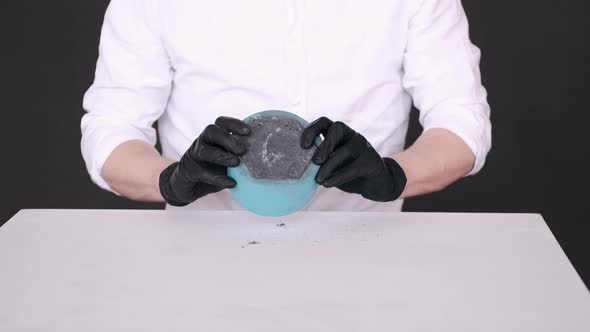 Closeup of Process of Making Pot Using Blue Stencil alt