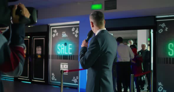 Male Reporter Announcing Black Friday Sale alt