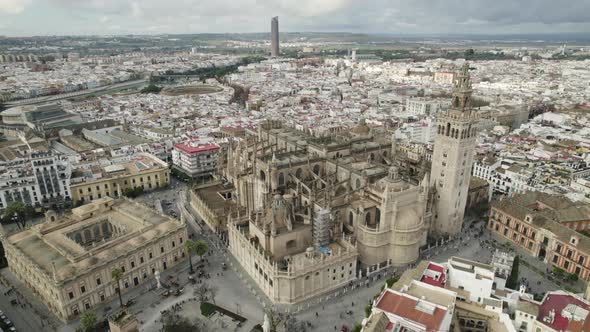 Seville Cathedral and the General Archive of the Indies against beautiful cityscape. Aerial view